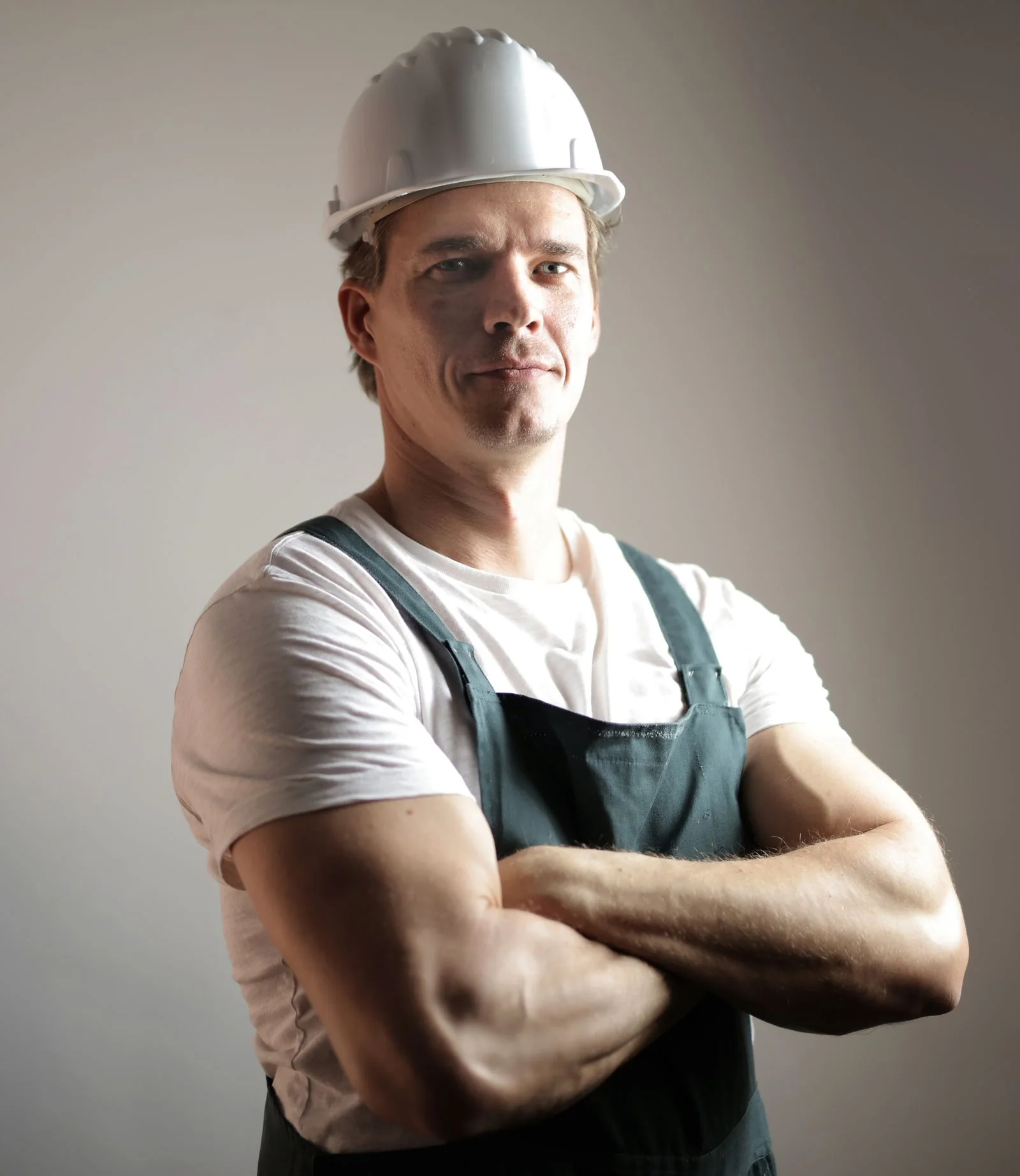 Confident contractor business owner standing with his arms crossed