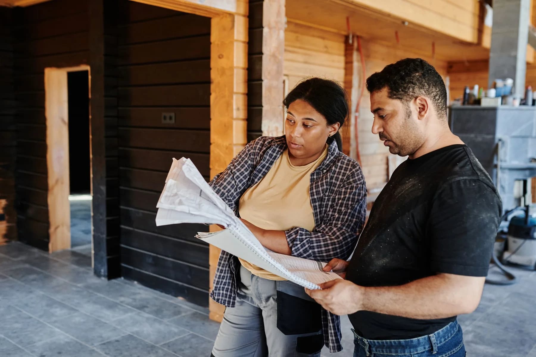 Contractors reviewing plans before work begins